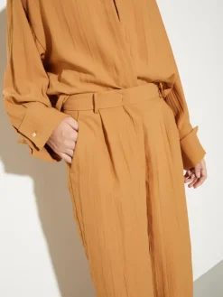 Crinkled envers-satin trousers - terra cotta