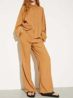 Crinkled envers-satin trousers - terra cotta